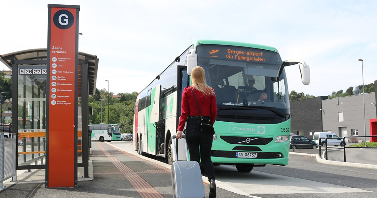 Green and white Flybussen airport express bus in Bergen